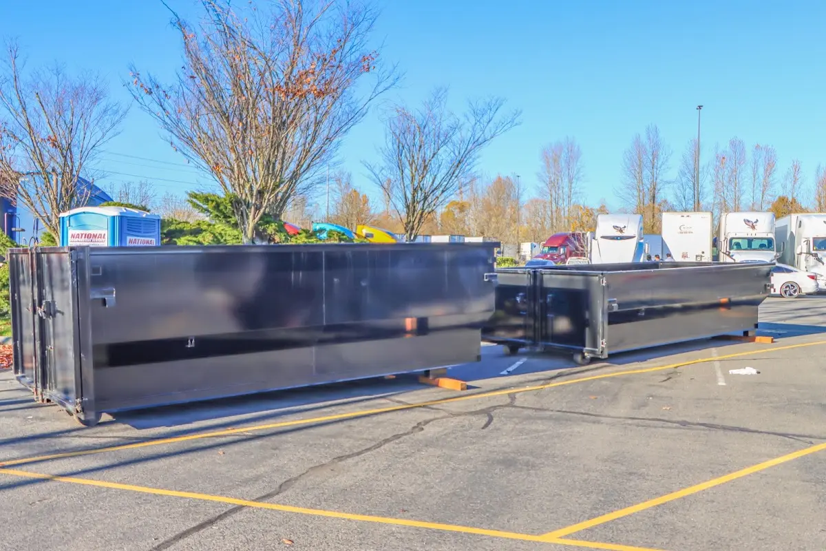 Professional dumpster rental service with roll-off container on residential driveway in New Lenox